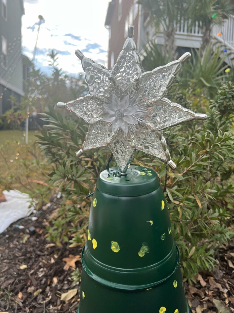 christmas tree topper on a pot tree