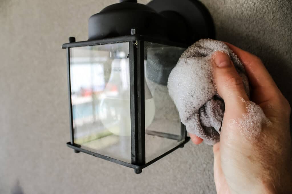 Cleaning light fixture with soapy rag