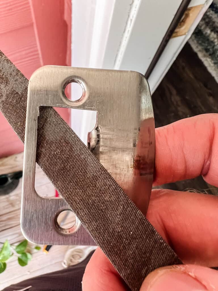 Filing down strike plate