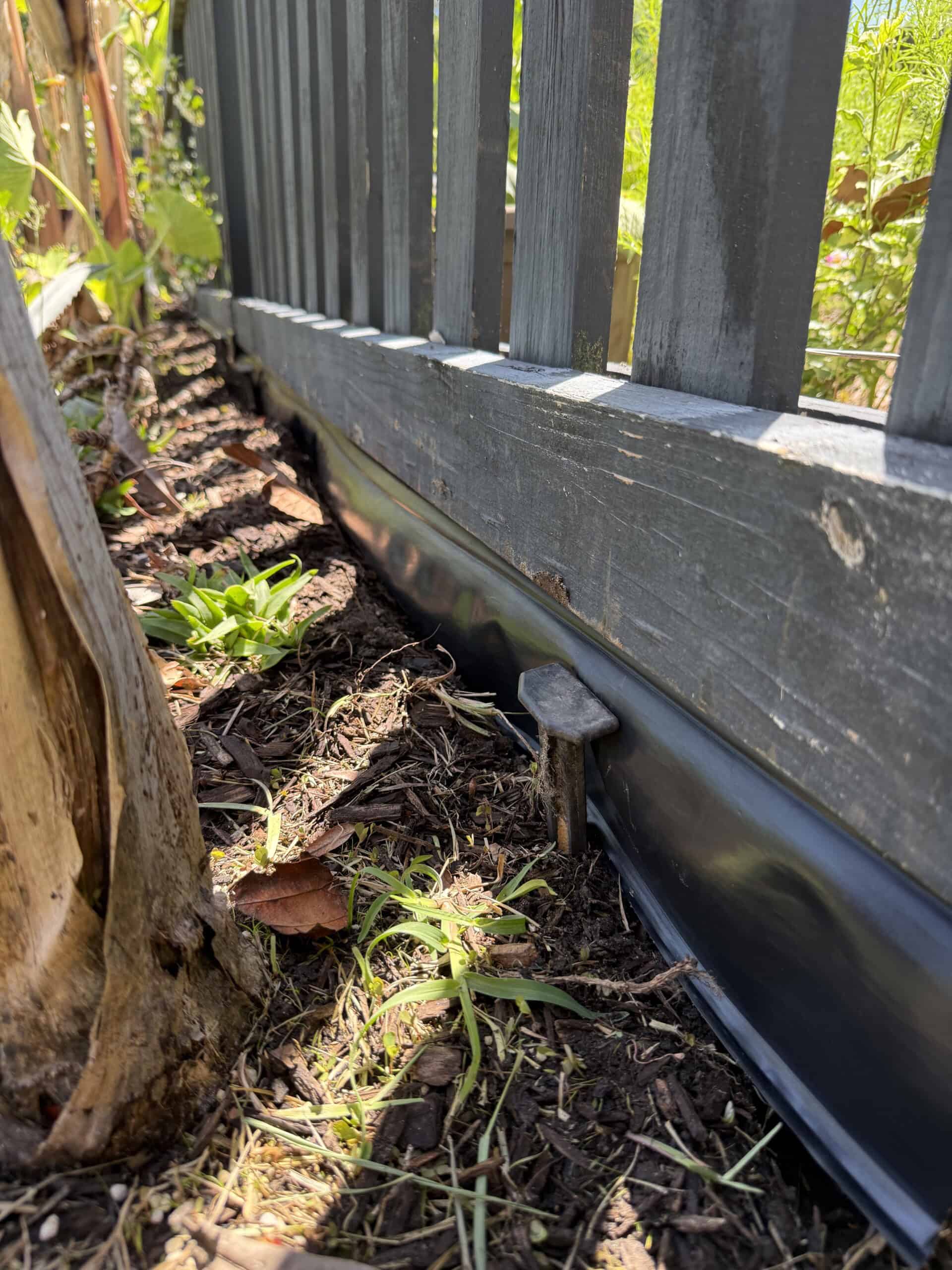 Stake holding edge barrier in