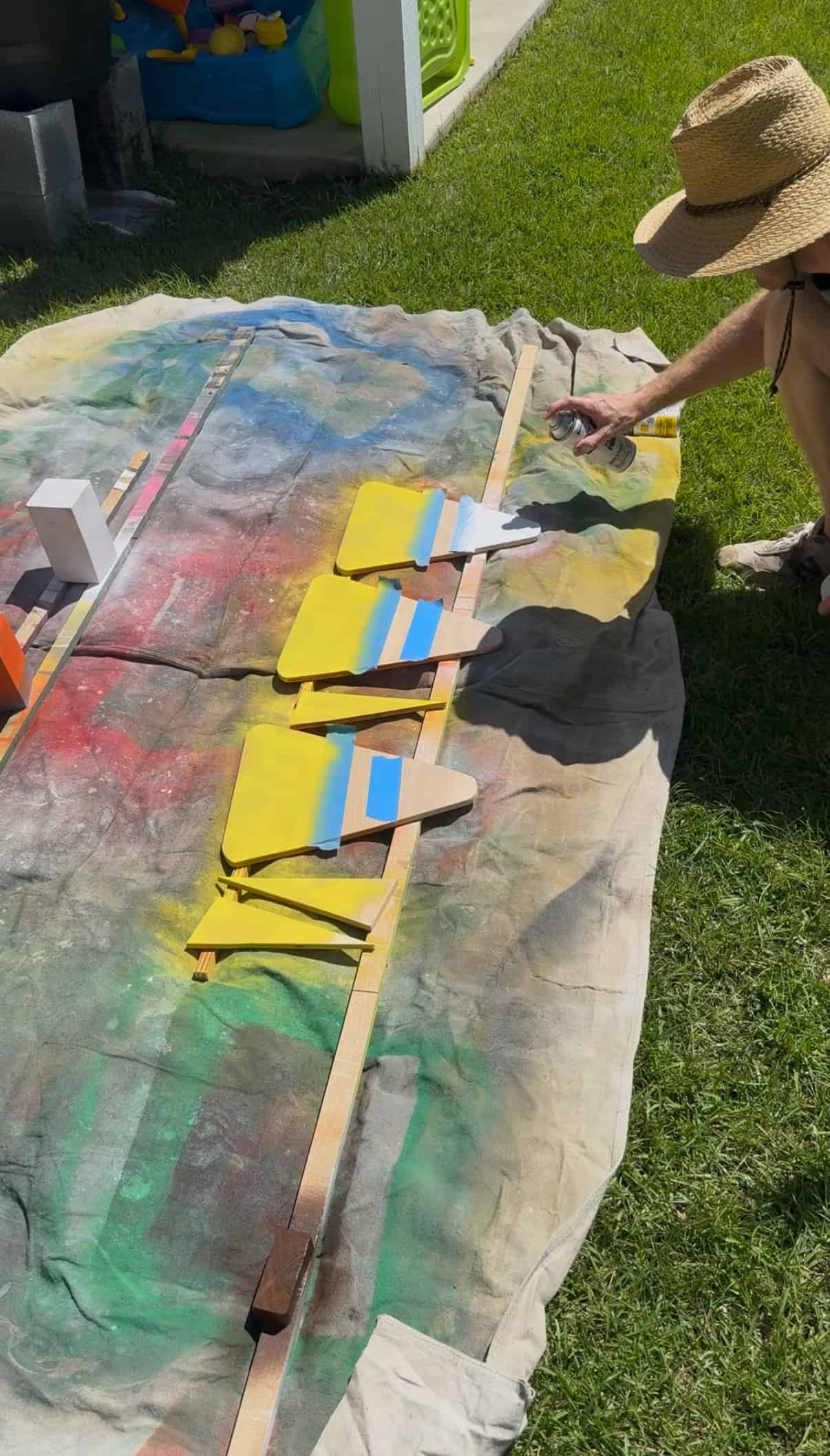 Spray painting candy corn yard stakes