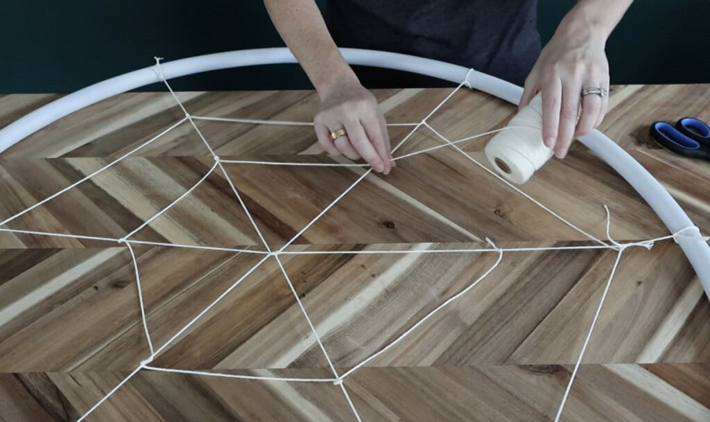 making a hula hoop spiderweb