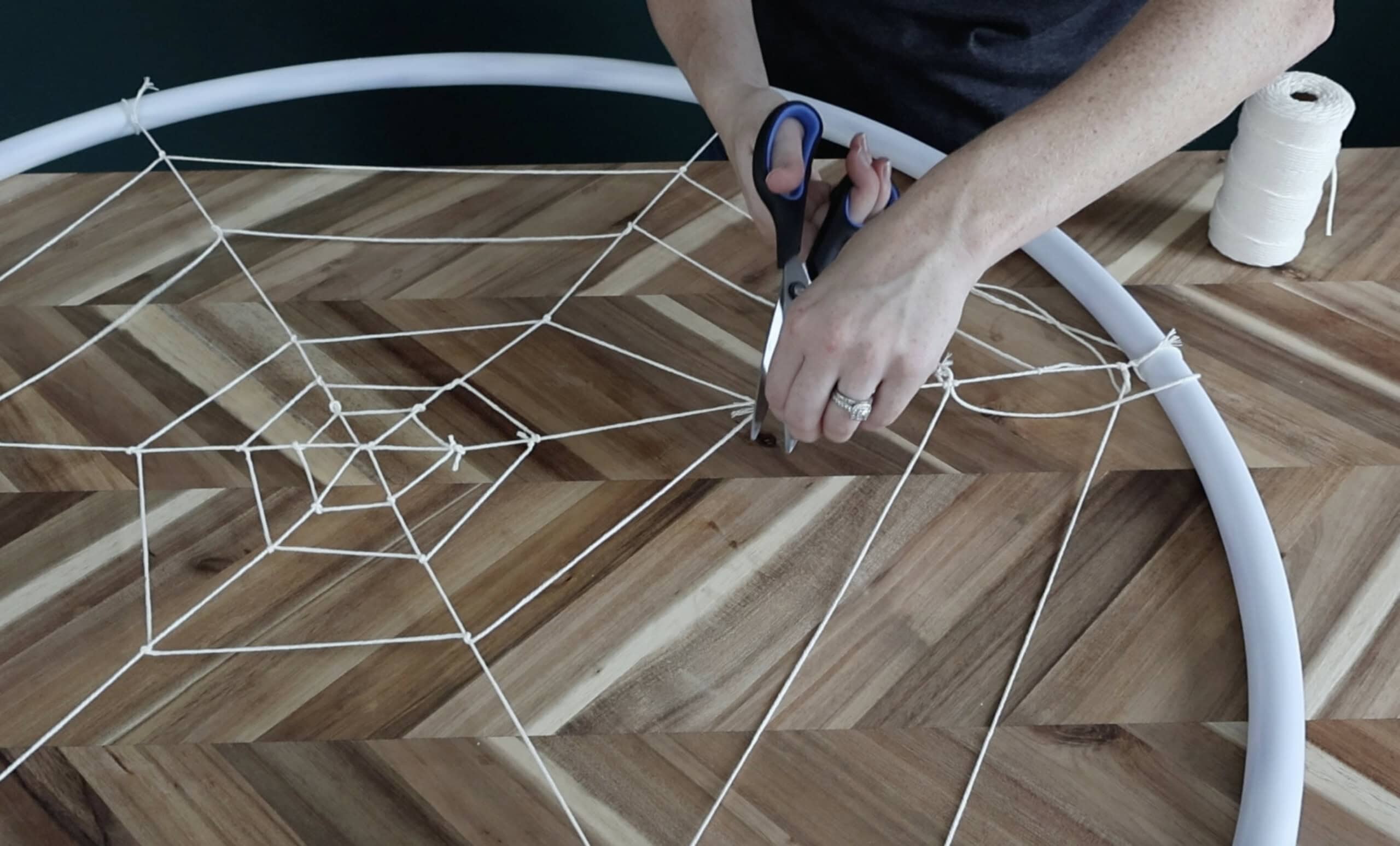 making a hula hoop spiderweb